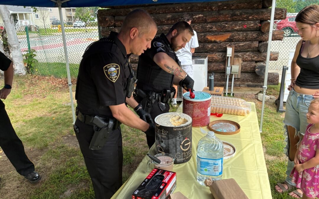 Officers serving ice cream at Cones with Cops